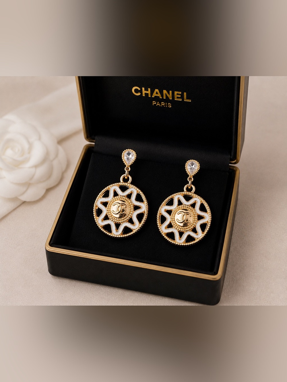 CHANEL Gold and White Sunburst Dangle Earrings